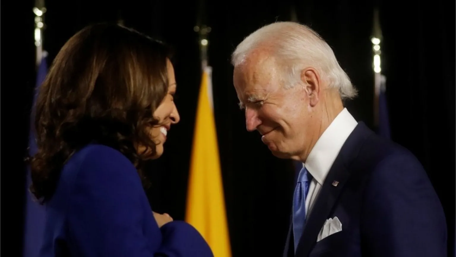 Biden and Harris facing each other and smiling